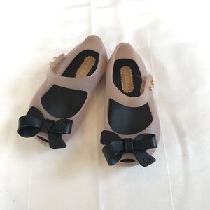 Mini Melissa pink shoes with black bow